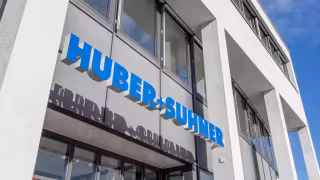 HUBER+SUHNER, ANGA COM 2025, fiber optic solutions, data center connectivity, GNSS timing, FTTH, HFC, optical circuit switching